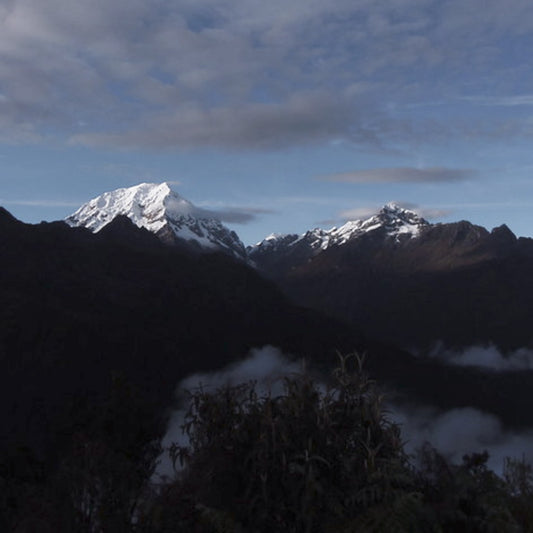 view over snow capped mountains from inca trail campsite