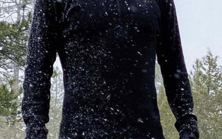 Man in snow wearing alpaca wool base layer and leggings