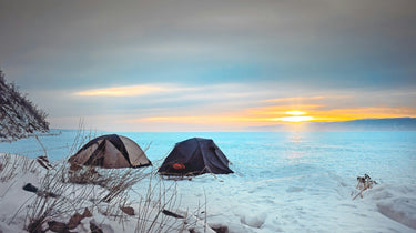 winter-camping-tents-frozen-lake-sunset.webp__PID:8762a30e-c430-4639-9361-d1aa26291863